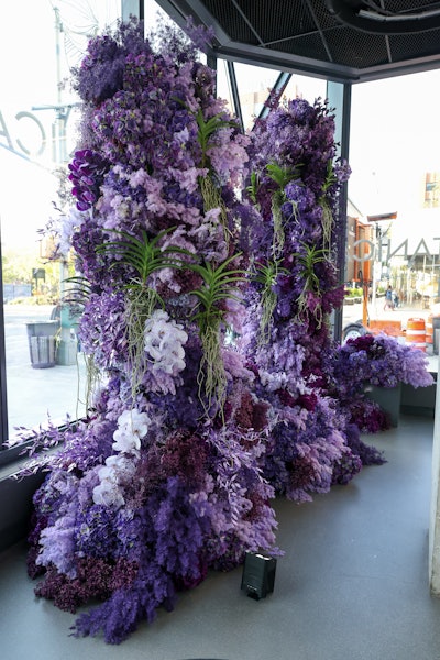 As guests enter Genesis House, they’re greeted by a series of cascading monochromatic floral displays and digital content that accentuate the structural design of the vehicles in the showroom.