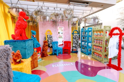 Event highlights included pet portraits, custom dog grooming complete with scented sprays and puppy manicures, a furry merch try-on station, a ball pit, and more.