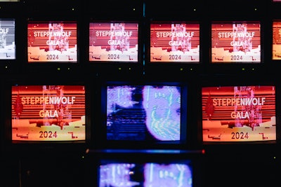 Guests posed for photos in front of a video installation designed by VIDEOWASTE.