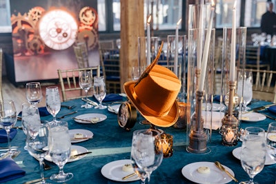 With the historic theater approaching its 50th anniversary, the passage of time felt like a relevant theme. Tables held vintage hats and clock elements to immerse guests in a steampunk feel.