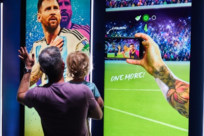 Visitors score a virtual selfie op with Messi.