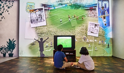 Guests can step through a re-creation of Messi’s childhood home and watch an animated story of his childhood in the style of a street art mural.