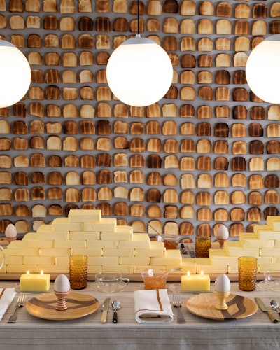 For another event, Stark was inspired by a simple pleasure: butter and toast. 'Inspired by one of my favorite books growing up, Bread and Jam for Frances, this charming breakfast utilized actual toast and sticks of butter as decor building blocks—literally,' he said.