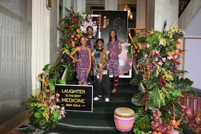 In addition to the stage design, the event's florals were used to continue telling the story of women around the world. JM Events Co. tapped four different floral designers—Lovesome Blossoms, Valerie Jurado, Riot Blooms, and Peachy Petals—to create centerpieces and installations that drew inspiration from South America, Southeast Asia, and Africa.