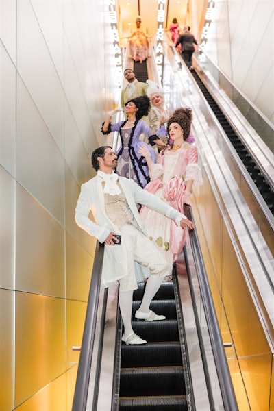 Entertainers from Jordan Kahn Music Company wore themed costumes that evoked various eras of music, creating immersive experiences throughout various spaces in the hotel—including the escalators.