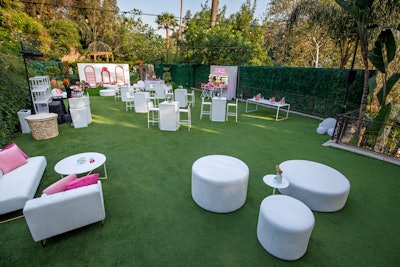 Guests made their way up the hillside and under the waterfall to the main event lawn, which featured a mini makeover station, a product display wall with a 5-foot bottle display, and branded macaron towers. The main event culminated with a set by DJ Michelle Pesce, a performance by mentalist Riccardo Berdini, and speeches by NAOS CEO Jeremy Bayen and Mikhail 'Mike' Oskarovich Varshavski, known online as Doctor Mike.