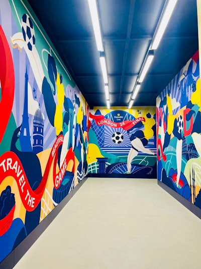 Expedia also partnered with London-based artist and football lover Kelly Anna to create bespoke tunnel artwork for the space, inspired by the theme of “Travel the Beautiful Game.” The piece captured several destinations that the UEFA Champions League has passed through in the 2023/24 season; the artwork was also replicated on a limited-edition football jersey for fans to win.