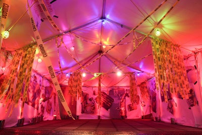 At 9 p.m., the 400 guests headed to the cabaret show in the Anne and John Kern Terrace Garden. Before entering the pop-up theater, they passed through a glowing red tent strung with caution tape and industrial lights. “We wanted to give guests the feeling of being transported to an exclusive underground club inspired by the late-night cabaret clubs of the early 1930s,” Hanas explains. “Historically, these clubs were a gathering place for celebrities and artists that allowed for freedom of expression outside the traditional values of the time.”