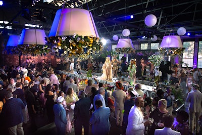 City Hall Events, a 1920s building that had former lives as a boiler factory and a truck-repair facility, was a new venue for the 725-guest event. “The Joffrey likes to not repeat venues, which is a challenge for an event of our size,” says planner Richard Williams of Richard Williams Events. “They are always looking for a new and exciting venue, so the biggest change each year is just that: the venue. City Hall, like many event spaces that were retrofitted from something else, is not without its challenges—namely behind-the-scenes space. With a band, a DJ, entertainers, event and technical staff, and catering, we had to get really creative with our greenrooms and catering prep space, but everyone put their heads together and we got there. Trust me, there wasn’t an inch of that building that we didn’t use, including the outside.” To wit: The check-in process took place outside the venue, where staffers clad in flower crowns greeted guests and took their names. “Because of the guest experience we wanted to create, all our guests came through one set of double doors, which meant needing an expeditious way to check them in,” says Williams. “We ended up lining the street with event staff armed with iPads, and we were able to get everyone checked in before they even stepped through the door. It went smoother than we could have hoped for.”