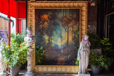 The event also had several photo activations, such as the one pictured, where guests could pose inside a gilded frame. “Utilizing interactive photo opportunities and decor pieces laced with performances, we hoped the guests would have no choice but to be pulled into the debauchery of it all,” Williquette says.