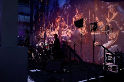 To underscore the spirit of “bacchanalian” revelry, the stage backdrop featured a scene of fantastical creatures at a rowdy forest feast. A full-moon sculpture dangled overhead.