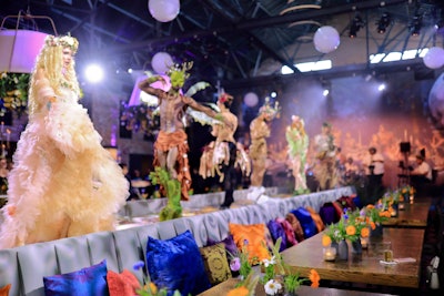 There was no formal seated program, but there were plenty of places to sit. At the front of the space, guests kicked back on pillow-strewn banquettes while costumed fairies and deer danced on an elevated runway.