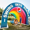 At Lollapalooza 2019, Pepsi offered shade under a giant prop rainbow. Guests could also swing under cloud-shaped balloons. See more: Lollapalooza 2019: Inside Guest-Focused Brand Activations from Brands Like Pepsi and Cupcake Winery