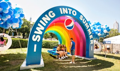 At Lollapalooza 2019, Pepsi offered shade under a giant prop rainbow. Guests could also swing under cloud-shaped balloons. See more: Lollapalooza 2019: Inside Guest-Focused Brand Activations from Brands Like Pepsi and Cupcake Winery