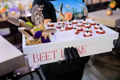 Holding Swedish-inspired fare such as beet latkes, appetizer trays were decorated with feathers, moss, flowers, and other decorations that seemed plucked from an enchanted forest floor. Food for Thought was the caterer.