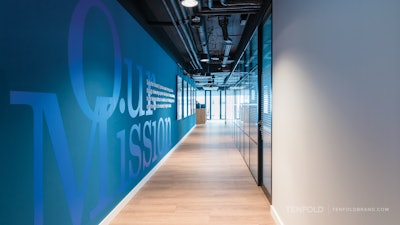 Steven A. Cohen's Point72 teamed up with TENFOLD to transform this otherwise humdrum hallway into an experiential moment that allows employees as well as existing and prospective clients to learn about the asset management firm's mission.