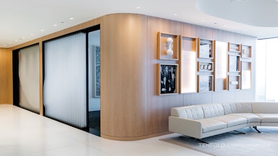 TENFOLD transformed the blinds at one end of Pritzker's meeting room into boat oars that each feature writing that speaks to the company's mantra.