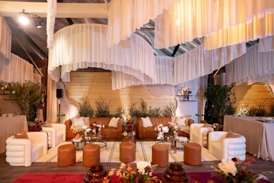 Speaking of the Emmys, this year’s Disney after-party—which followed the postponed ceremony that took place in January—leaned into the winter season with an “Après Fête” theme. Designed and produced by Sterling Engagements, the event's highlight might've been this ceiling installation, where poly chiffon draping in monochromatic tones created a decorative display.