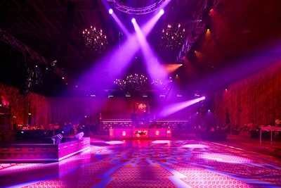 Taking over two soundstages, the event featured 31,000 square feet of carpet surrounded by 20,000 square feet of 32-foot-high drape, creating a red canvas with projected graffiti layered on the walls.