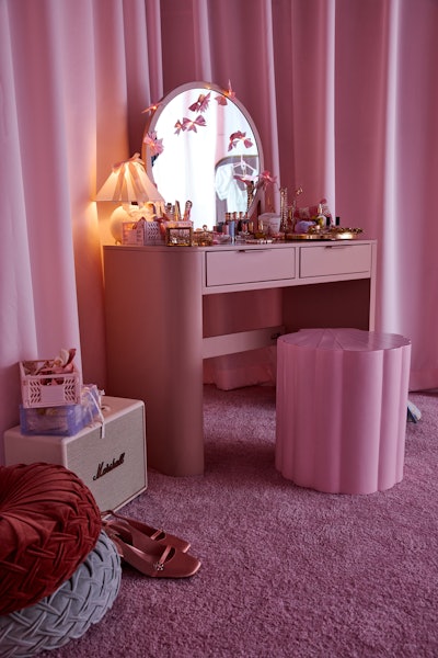 All things pink, from bows to bedding to a lipstick-hued vanity table, filled the Sweetheart Suite. Curated by photographer Morgan Maher, the space embodied the Pinterest trends vintage coquette room, pretty dorm room, and bows aesthetic. Guests could have their portraits snapped within the space.