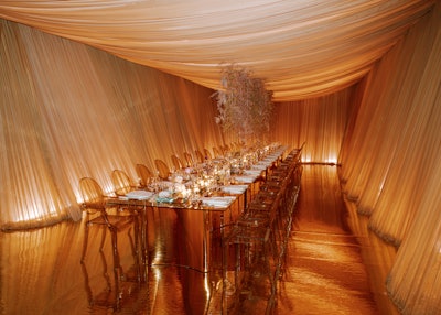 Draping also has the power to transport. Take it from this dinner benefit designed by Toronto-based CANDICE&ALISON, who drew inspiration from what they imagined the view would be from under Monet's pond. 'The dramatic angled drape lines represent beams of light cutting through the surface of the water,' partner Candice Chan told us. 'The lighting effects behind the drape slowly changed colors over the course of the evening, representing the different times of daylight.'