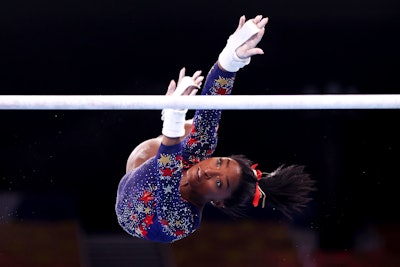 Getty Images photographer Laurence Griffiths captured Simone Biles as she competed on uneven bars during Women's Qualification at the 2020 Tokyo Olympic Games.