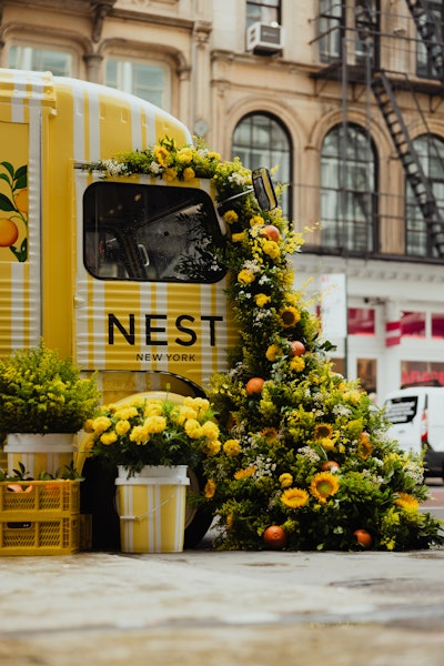 The branded vintage truck was adorned with a large floral installation and displayed NEST's juicy grapefruit collection. Visitors could scan a QR code to sign up for SMS updates, and upon showing their confirmation text, they received their gifts. In total, the team served 2,400 samples while also encouraging attendees to discover and shop more of the NEST collection across the street at Bloomingdale's.