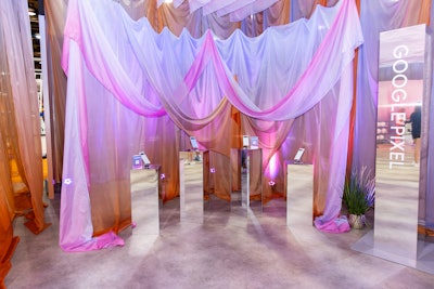 Drapes definitely added to the illusion of Google's Wonders of the W activation at this year's WNBA Live fan experience, which took place ahead of the All-Star Game. Here, they accentuated a product display of Google Pixel phones. Google produced the activation with The Robot Co and NRG Experiential.