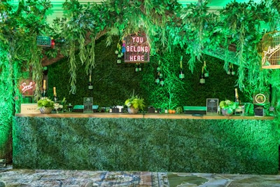 In February, The Children’s Oncology Support Fund's Aspen Snow Ball merged fantasy and nostalgia with a Through the Looking Glass theme. The idea was to lean into a more surrealist and modern approach to the Alice in Wonderland tales. An antique clock shaped the entrance, which led guests into a foliage-filled garden space that mixed effervescent lighting, weaving vines, and vibrant, large-scale floral arrangements. Throughout the space, neon signs from featured artist Olivia Steele added a unique and whimsical touch. See more: This Gala Offered a Surrealist Take on a Classic Event Theme