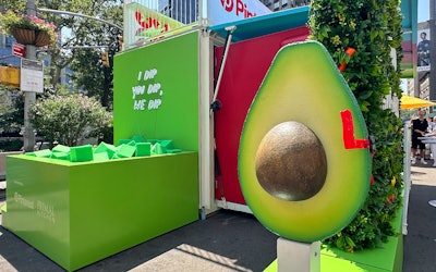 An avocado mailbox is filled with recipes.