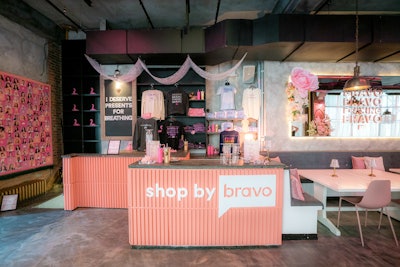 A merch shop sells official Bravo clothing and jewelry from The Bond Society.