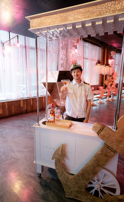 Servers donning Below Deck-style captain’s attire greet guests with a glass of Bravo rosé as they enter the experience.
