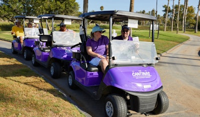 Guests puttered around in branded golf carts.