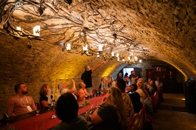 Participants were treated to a gathering inside Vin Villa's South Tasting Room. The stone ceiling features grapevines hand-tooled from solid copper and steel to form a 48-foot-long chandelier.