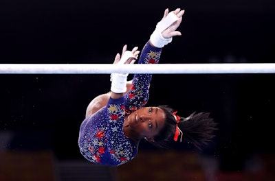 Getty Images photographer Laurence Griffiths captured Simone Biles as she competed on uneven bars during Women's Qualification at the 2020 Tokyo Olympic Games.