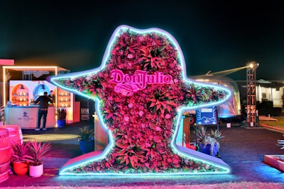 At Neon Carnival during Coachella 2022, sponsor Don Julio Tequila grabbed attention with an oversize, succulent-filled version of its logo, produced by NVE Experience Agency. See more: Coachella 2022: Peek Inside the Festival's Buzziest Parties & Brand Activations