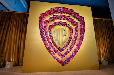 In 2024, Warner Bros. hosted its Oscars after-party at West Hollywood's LAVO Ristorante. The event was produced by Jennifer Wang of JWang Consulting, who created a statement moment by filling the iconic WB shield with florals in various shades of purple and pink (a nod to nominated films The Color Purple and Barbie). See more: Oscars 2024: Peek Inside the Week's Most Star-Studded Events