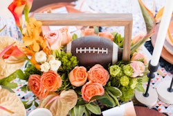 Your football parties probably include six-packs, chicken wings, and seven-layer dip. But, if you’re looking to add a bit of an upscale twist, grab some inspiration from this 2022 styled shoot from Los Angeles-based event company At Your Door Events. The team aimed to reimagine the modern Super Bowl party with stylish twists on football-themed decor, like this vibrant centerpiece.