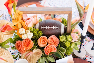 Your football parties probably include six-packs, chicken wings, and seven-layer dip. But, if you’re looking to add a bit of an upscale twist, grab some inspiration from this 2022 styled shoot from Los Angeles-based event company At Your Door Events. The team aimed to reimagine the modern Super Bowl party with stylish twists on football-themed decor, like this vibrant centerpiece.