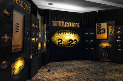 In 2023, Gifts for the Good Life returned to the College Football Playoff National Championship game for its sixth season, where it brought California cool and Hollywood glam to a VIP swag suite. The collectible football is always a highlight of the CFP gifting suite, so the team presented it in a dramatic black box meant to feel like an award. The awardlike motif continued throughout the room itself, which housed a gigantic version of a black box holding the gold footballs and lighting that evoked a Hollywood marquee. See more: Tips for Creating a Memorable Gifting Experience—Courtesy of the College Football Playoff