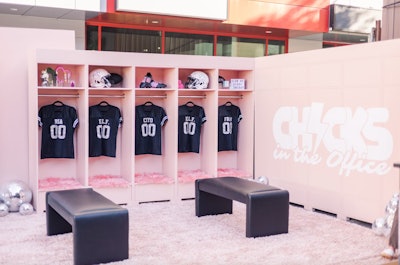 In September 2023, Barstool Sports’ Chicks in the Office podcast and e.l.f. cosmetics presented a pretty pink locker room setup at Orange Crate Brewing Company in Syracuse, N.Y., as the Clemson Tigers took on the Syracuse Orange. The activation was stocked with e.l.f. products as well as branded football gear and merch. Marketing agency Coleture handled the fabrication.