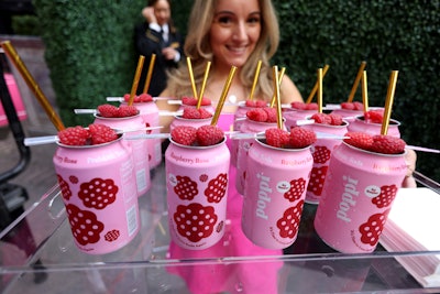 Courtside, Raspberry Rose Sparkler cocktails starring poppi were on offer, as well as mini bottles of Moët & Chandon; Honey Deuces (of course); and elevated bites such as whipped ricotta tartlets, wagyu beef tataki, caviar-topped potato bites, and tennis ball macarons—all executed courtesy of Lotte New York Palace executive chef Cedric Tovar. Guests sipped and savored while American tennis legend Andre Agassi made a special appearance to offer up some expert commentary.