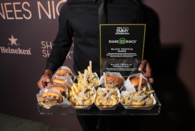 Shake Shack featured its new limited-edition black truffle burger and black truffle Parmesan fries at the star-studded event, offering to-go bags to guests as they exited the party.
