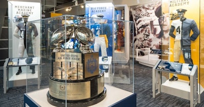 The new 'Military and Football' exhibit includes a tribute to U.S. Service Academies, the retired Commander-in-Chief’s Trophy, a desk belonging to Gen. Douglas MacArthur, and a video wall displaying stadium flyovers.
