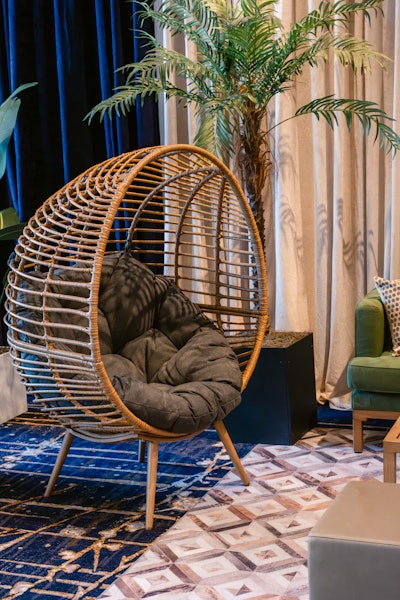 Indoor-outdoor papasan-style Aruba chair with charcoal cushion, price upon request, available nationwide from CORT Events