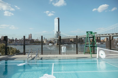 DUMBO House's rooftop pool was made to look like a tennis court, complete with a net and chair umpire's chair.