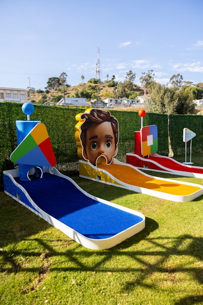 Mini-golf putting greens were decorated in the brand's signature colors.