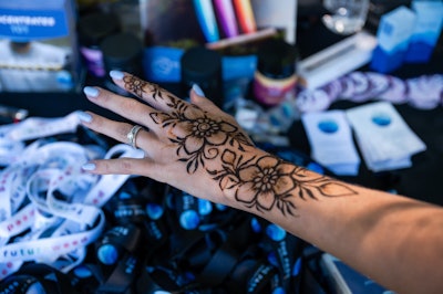 In the Chill Zone, guests could have tarot readings, get henna tattoos (pictured), and bond over music bingo.