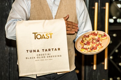 Servers carried the menu items printed directly on linen napkins draped over their arms.