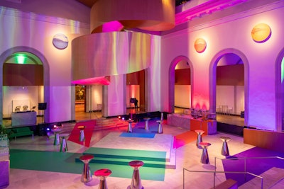 For the after-party in the museum's Walker Court, meanwhile, CANDICE&ALISON leaned into bold colors and metallic accents inspired by the “Moments in Modernism” exhibit, bringing the vibrant hues of Jack Bush’s paintings to life. The large main stage and bars were clad in a marble decal that perfectly matched the existing marble of the room, making the entire setting of the party one big canvas for the large strokes of color.